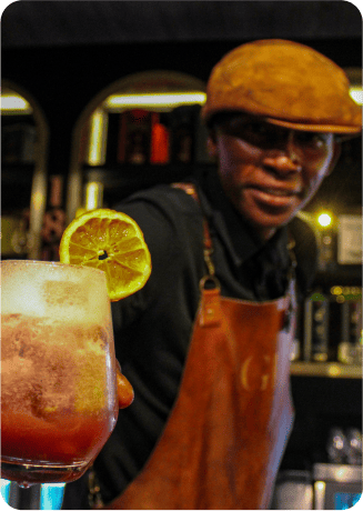 Barman handing out a drink